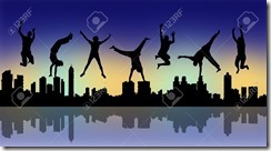 20669720-silhouettes-of-young-happy-people-jumping-a-big-city-panoramic-silhouette-by-night